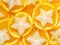 Carambola stars and orange slices background, top view, macro. Citrus Seamless Pattern