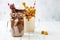 Caramel and chocolate crazy freakshake, milkshakes with brezel waffles, popcorn, marshmallow, ice cream and whipped cream.