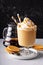 Caramel coffee latte in a dessert glass