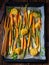 Caramelised carrots, spring onions and baked potatoes