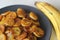 Caramelised plantain slices. A traditional tea time snack from Kerala.Cut ripe plantain into slices and toast it in a pan adding