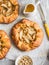 Caramelized apples rustic pie on light background