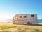 Caravan car parked by the sea in spring season before sunrise