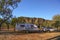 Caravan and four wheel drive vehicle at camping area at Windjana Gorge in the Kimberley region of Western Australia