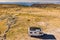 Caravan solar panels on roof camp in mountains. Aerial view