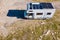 Caravan solar panels on roof camping on nature. Aerial view