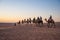 Caravan with tourists in the sahara desert