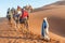 Caravan with tourists in the sahara desert