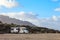 Caravan trailer parked on a beach with mountains view on Canary