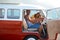 Caravan, transportation and couple on road trip, travel and vacation with portrait of people in relationship. Happiness