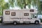 Caravan travel trailer RV motor home camper. Car vehicle journey. Tourism Summer vacation holidays activity trip to Europe. Mobile