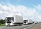 Caravan of white trucks on highway