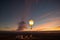 carbon dioxide balloon rising into the air, with sunset in the background