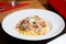 Carbonara pasta. Carbonara is an Italian pasta dish from Rome made with eggs, hard cheese, cured pork, and black pepper.