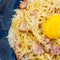 Carbonara paste in a blue plate. national italian dish