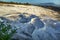 Carbonate travertines the natural pools during sunset, Pamukkale, Turkey