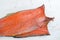 Carcass of Cold smoked pink salmon on a wooden background