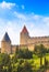 Carcassonne Cite, medieval fortified city on sunset. Unesco site