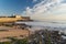 Carcavelos, Portugal - 12/31/18: Praia de Carcavelos view of Saint Julian Fortress with lighthouse tower