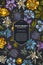 Card design on dark background with bellflower, edelweiss, globethistle, globeflower, meadow geranium, gentiana