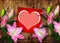 Card with heart and pink Lily flower