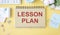 card paper with text LESSONS PLAN on a yellow background. Education and study concept