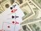 Card playing dollars background playing poker cash success opportunity risk closeup