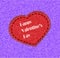 Card by a St. Valentine\'s Day heart from fabric is sewed on a color background