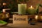 Card with word Retreat, singing bowls and burning candles on wooden table, closeup