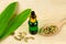 Cardamom essential oil in glass bottle.