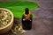 Cardamom essential oil in glass bottle.