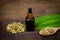 Cardamom essential oil in glass bottle.