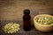 Cardamom essential oil in glass bottle.