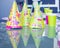 Cardboard birthday party hats with patterns and colorful cups. Copy space