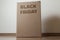 Cardboard box with black friday order written on the box