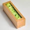 Cardboard Box Filled With Green Vegetables on Table