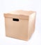 Cardboard box isolated on white background. Blank moving box with handles, packshot photo.