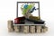 Cardboard boxes around globe on laptop screen, cargo ship, truck and plane