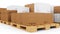 Cardboard boxes on wooden pallets isolated on a white background. Cardboard boxes for the delivery of goods. Packages