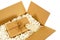 Cardboard delivery box with brown paper mail package and blank manila address label