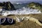 Cardboard letters with the word summer written with a beach in the background