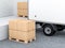 Cardboard parcel boxes on euro pallet near Cargo Truck, warehouse