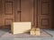 Cardboard parcel at the doorstep, delivery and courier. Mockup