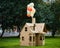 Cardboard playhouse in the backyard for kids. Eco concept