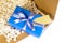 Cardboard shipping delivery box blue gift inside, polystyrene packing pieces, top view