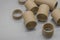 Cardboard spools for winding. Reels made of cardboard. Background of cardboard bobbins. Selective focus