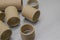 Cardboard spools for winding. Reels made of cardboard. Background of cardboard bobbins. Selective focus