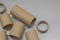 Cardboard spools for winding. Reels made of cardboard. Background of cardboard bobbins. Selective focus