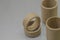 Cardboard spools for winding. Reels made of cardboard. Background of cardboard bobbins. Selective focus