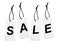 Cardboard tags with word SALE on background